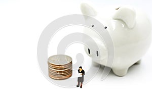 Miniature people: Elderly person standing  with coins stack and piggy bank, Retirement planning concept