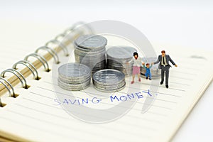 Miniature people, family figure standing on top of stack coins . Image use for background retirement planning, Life insurance