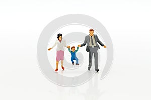 Miniature people: Family figure standing on white floor . Image use for background retirement planning, Life insurance concept