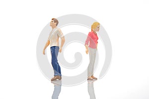 the miniature people. figures of a man and a woman on a white background. communication and relationship building. problems in