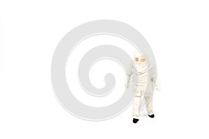 Miniature people firemen construction concept on white background with a space for text