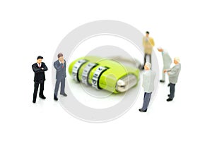 Miniature people: Group businessman and security key . Image use for background security system, hack, business concept