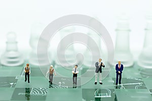 Miniature people, Group Businessmen standing on the chess game, thinking solution for the business game, use as a business