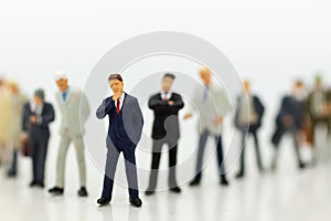 Miniature people, Group of businessmen work with team, using as background Choice of the best suited employee,