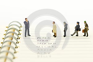 Miniature people, Group of businessmen work with team, using as background Choice of the best suited employee,