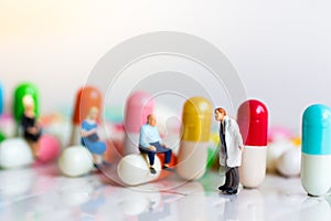 Miniature people: Group people queue up to wait for the doctor. Image use for Health check concept photo