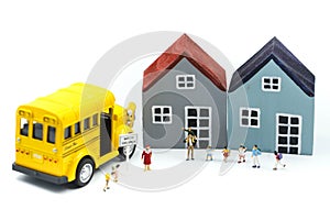 Miniature people : A group of young children getting on the schoolbus,schoolbus transportation education