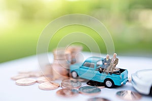 Miniature people: Happy old people sitting on coins stack, Retirement  and Life insurance Concept.