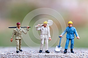 Miniature people  holding tools and copy space for your text , Labour day concept