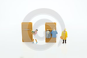 Miniature people : Housewives hire laundry - ironing, profitable business. Image use for housework, business concept photo