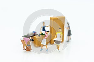 Miniature people : Housewives hire laundry - ironing, profitable business. Image use for housework, business concept photo