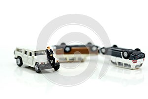 Miniature people : Insurance Agent examine Damaged Car and filing Report Claim Form after accident.
