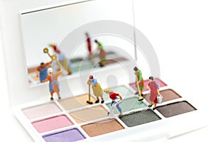 Miniature people : Maid or Housewife cleaning on Makeup products