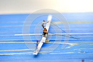 Miniature people : man fishing on a lake from the boat