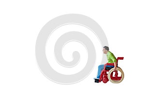 Miniature people Man in wheelchair isolated with clipping path