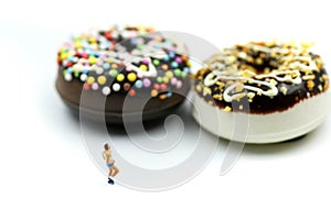 Miniature people : marathon runners with measuring tape of Sweet dessert ,jogging and running,Active and healthy lifestyle concept