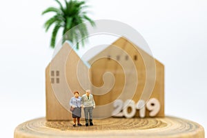 Miniature people, Old couple figure. Image use for background retirement planning, Life insurance concept.