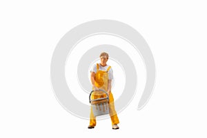 Miniature people, Painter holding paint bucket on white background with clipping path