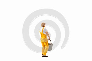 Miniature people, Painter holding paint bucket on white background with clipping path