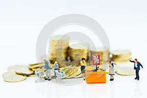 Miniature people : Shoppers with shopping cart . Image use for retail business concept