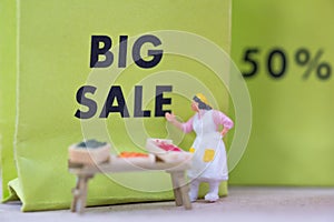 Miniature people : Small retailers create a promotion to compete against big malls