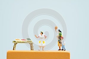 Miniature people : Small retailers create a promotion to compete against big malls photo