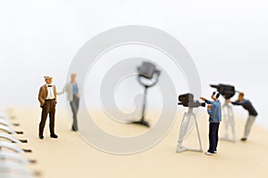 Miniature people : Small team of tv reporter with Celebrity Interviews, production television concept