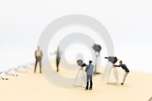 Miniature people : Small team of tv reporter with Celebrity Interviews, production television concept photo