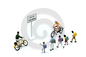 Miniature people : student or children crossing road on way to s