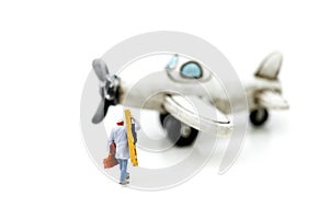 Miniature people : technician, mechanic with airplane using for