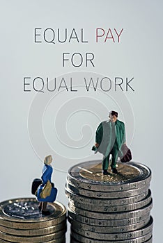 Miniature people and text equal pay for equal work