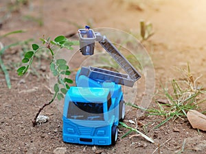 Miniature People and toys: Worker at the construction with chery picker truck background