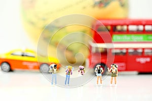 Miniature people : Traveler backpacking Calling Taxi with tourist bus,Travel concept.