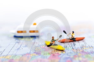 Miniature people : Travelers with paddle boat . Image use for activities, travel business concept