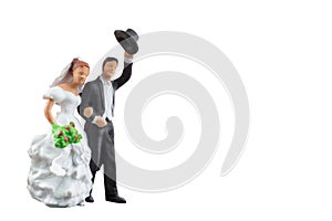 Miniature people wedding isolated on white background with clipping path