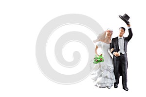 Miniature people wedding isolated on white background with clipping path
