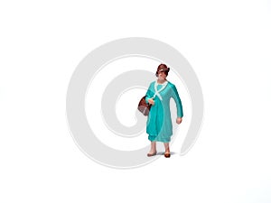 Miniature people woman carrying bags