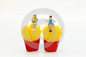 Miniature people : Woman sitting on junkfood. Image use for healthcare and diet concept