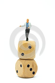 Miniature people : Women standing on dice. Image use for to solve problems, risk management , business concept