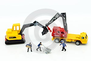 Miniature people: Workers help to moving crates for building home . Image use for construction, business concept