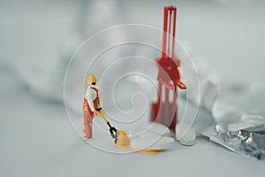 Miniature people: Workers help to moving drug. Image use for health check concept