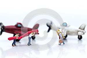 Miniature people: Workers prepare equipment for maintenance of t