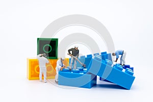 Miniature people : Workers are repairing, arranging components for construction work. Use images for construction business