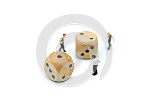 Miniature people : young businessman standing on dice,Gambling a