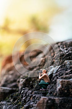 Miniature photographer taking photo