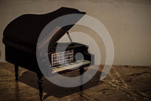 Miniature of Piano with papers of music
