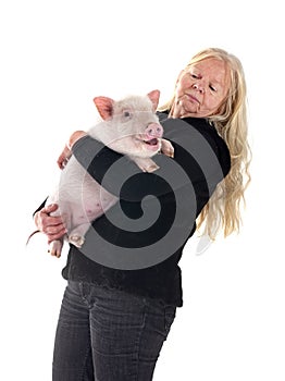 miniature pig and woman in studio