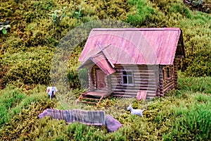 Miniature of realistic rural countryside landscape with a wooden windmill and people