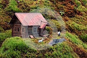 Miniature of realistic rural countryside landscape with a wooden windmill and people