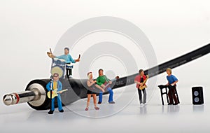 Miniature of a rock band playing on the harmonica